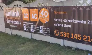 Baner reklamowy Unilink z informacją o ubezpieczeniach OC/AC, adres i telefon kontaktowy.